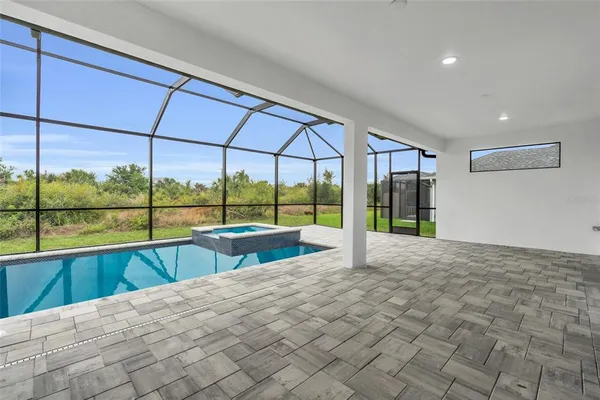 a view of house with a big yard and swimming pool