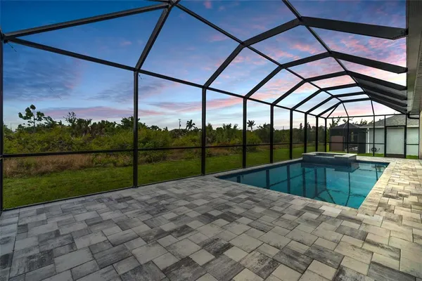 a view of swimming pool with a back yard