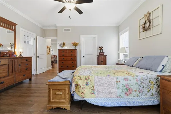 a bed room with a bed and dresser