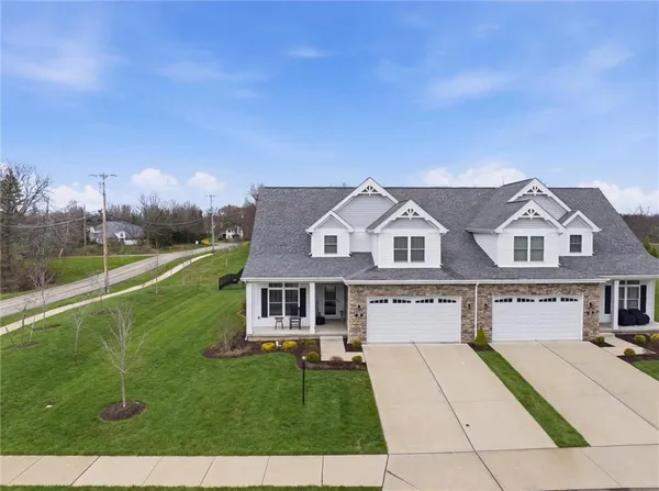 front view of a house with a yard