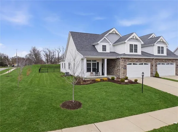 an aerial view of a house with a big yard