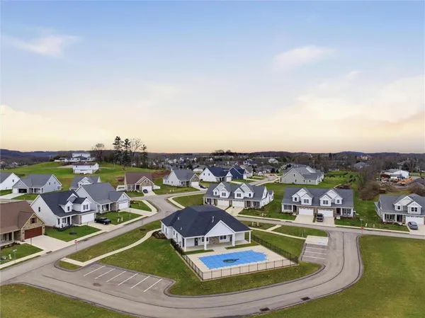 an aerial view of a house with a swimming pool