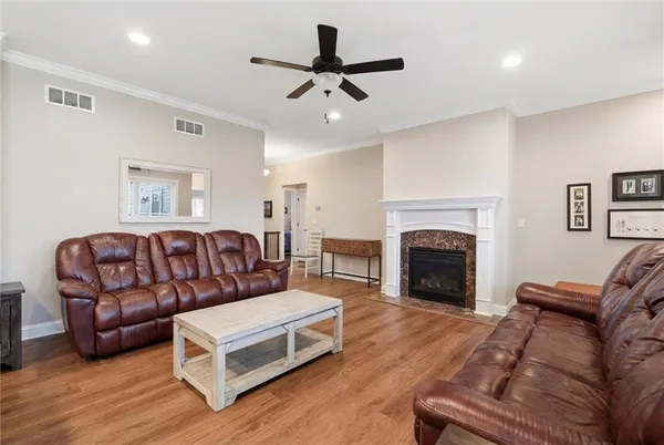 a living room with furniture or fireplace and a wooden floor