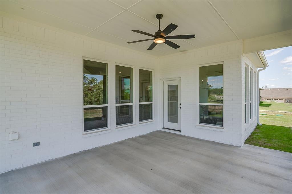 9012 Valley Oak Court Springtown, TX 76082 - Photo 35 of 40 a view of a livingroom with a ceiling fan and window