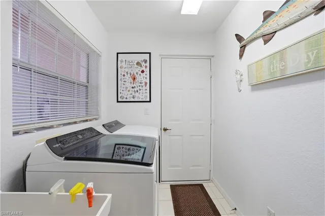 a view of a room with workspace and windows