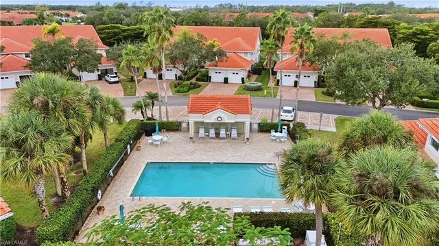 an aerial view of a house with a lake view