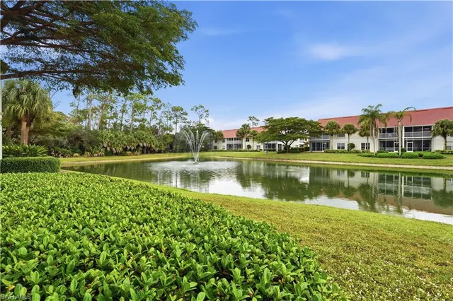 a view of a lake with houses in the background