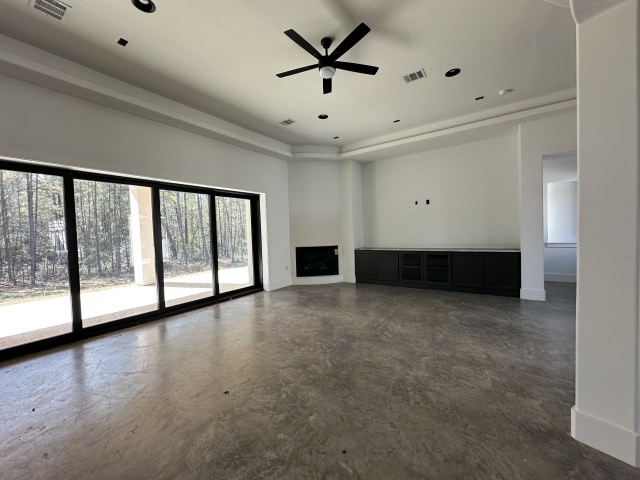 875 Lonestar Road Huntsville, TX 77340 - Photo 9 of 24 a view of a livingroom with a ceiling fan and window