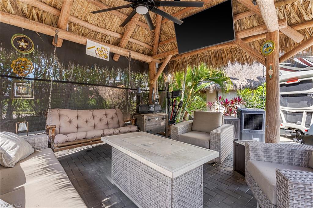 13580 Snook Circle Naples, FL 34114 - Photo 12 of 33 a view of a patio with couches and potted plants