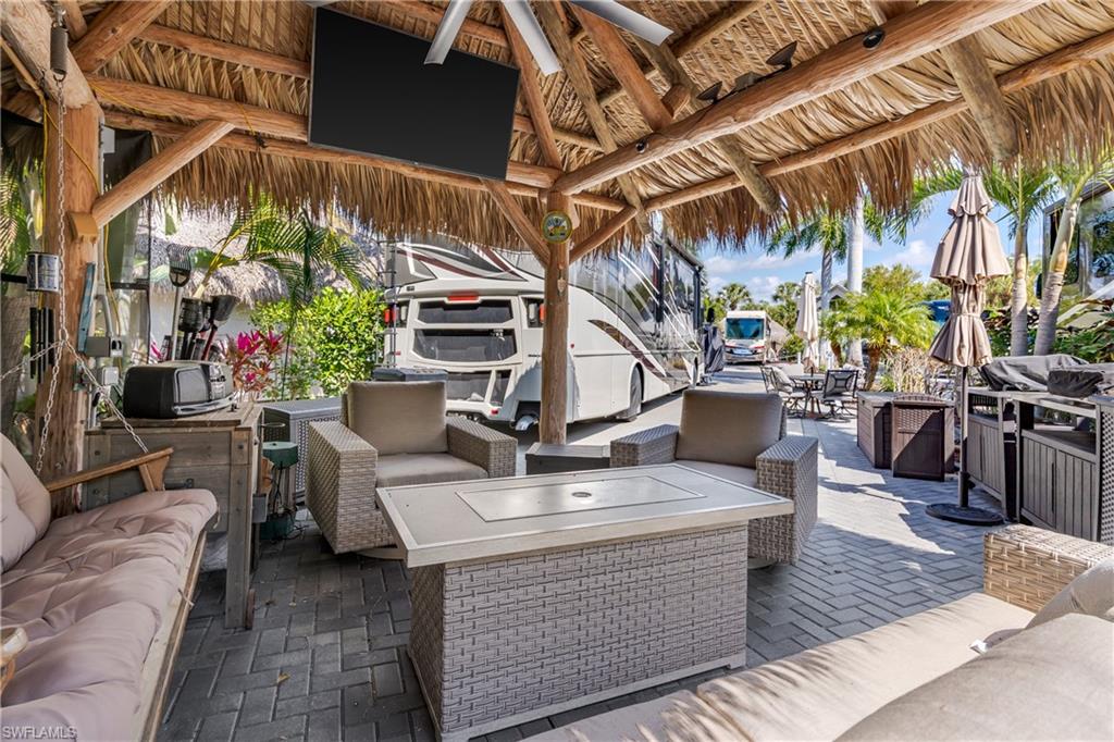 13580 Snook Circle Naples, FL 34114 - Photo 13 of 33 a view of a chairs and table in the patio