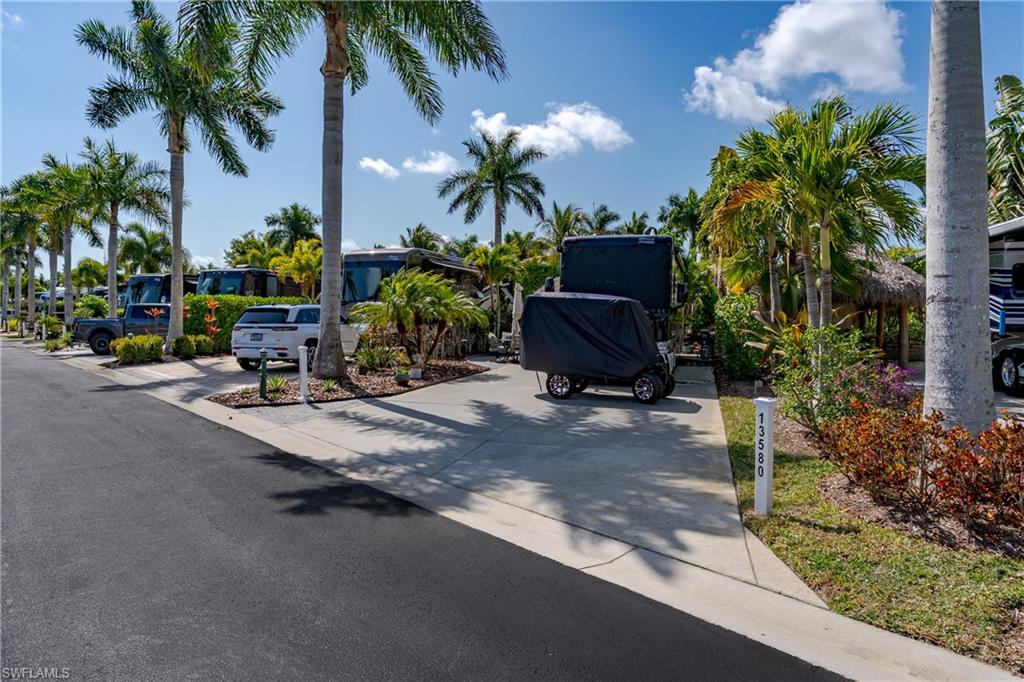 13580 Snook Circle Naples, FL 34114 - Photo 14 of 33 a backyard of a house with outdoor seating