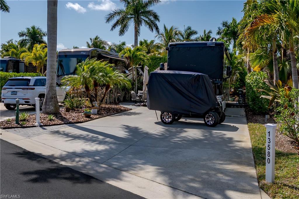 13580 Snook Circle Naples, FL 34114 - Photo 15 of 33 a view of a backyard with a sitting area and furniture