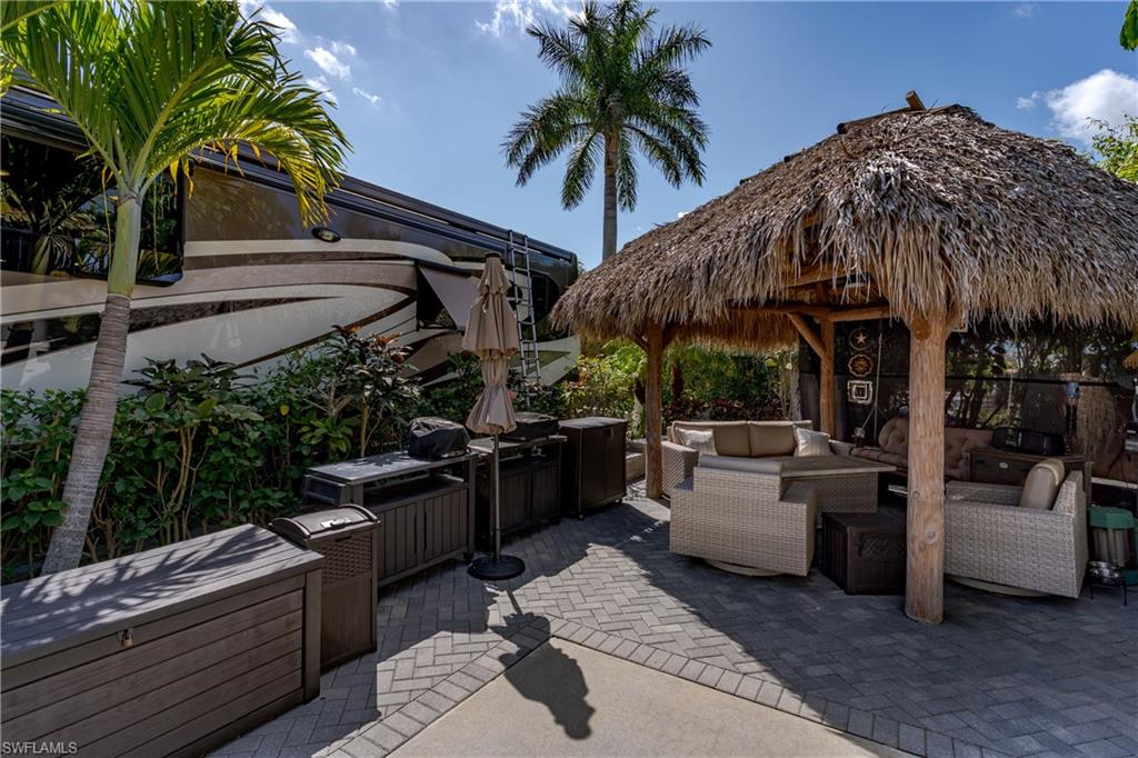 13580 Snook Circle Naples, FL 34114 - Photo 5 of 33 a view of a terrace with couches and potted plants