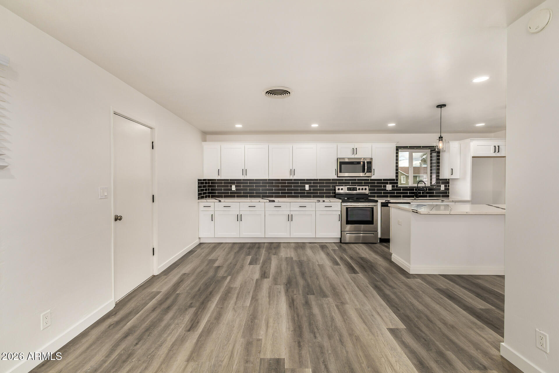 533 West 18th Street Tempe, AZ 85281 - Photo 17 of 52 a large kitchen with a lot of counter space and stainless steel appliances