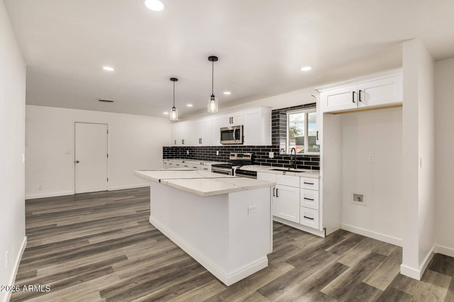 533 West 18th Street Tempe, AZ 85281 - Photo 18 of 52 a kitchen with stainless steel appliances kitchen island sink stove and cabinets