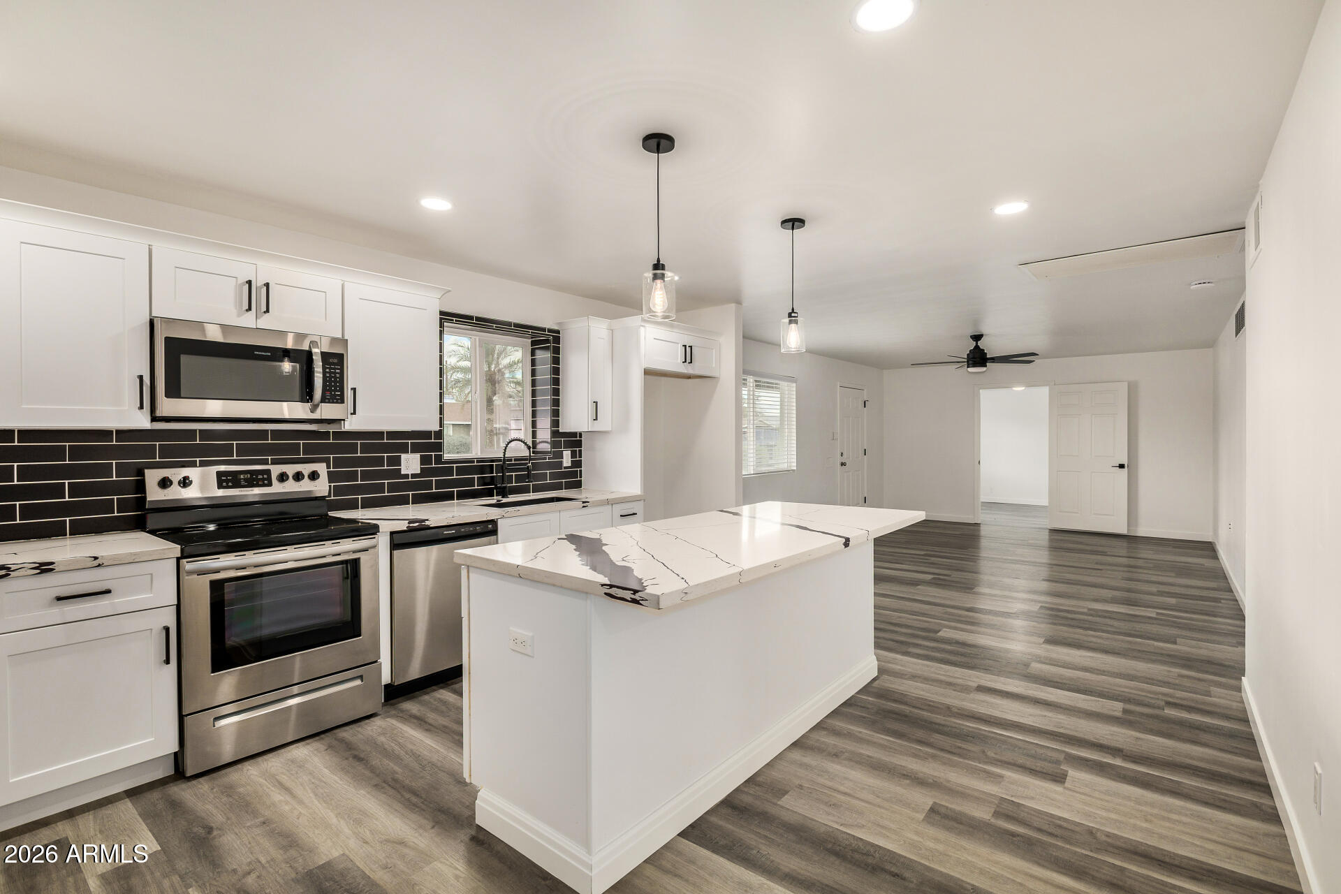 533 West 18th Street Tempe, AZ 85281 - Photo 19 of 52 a large kitchen with stainless steel appliances granite countertop a stove a sink and a refrigerator