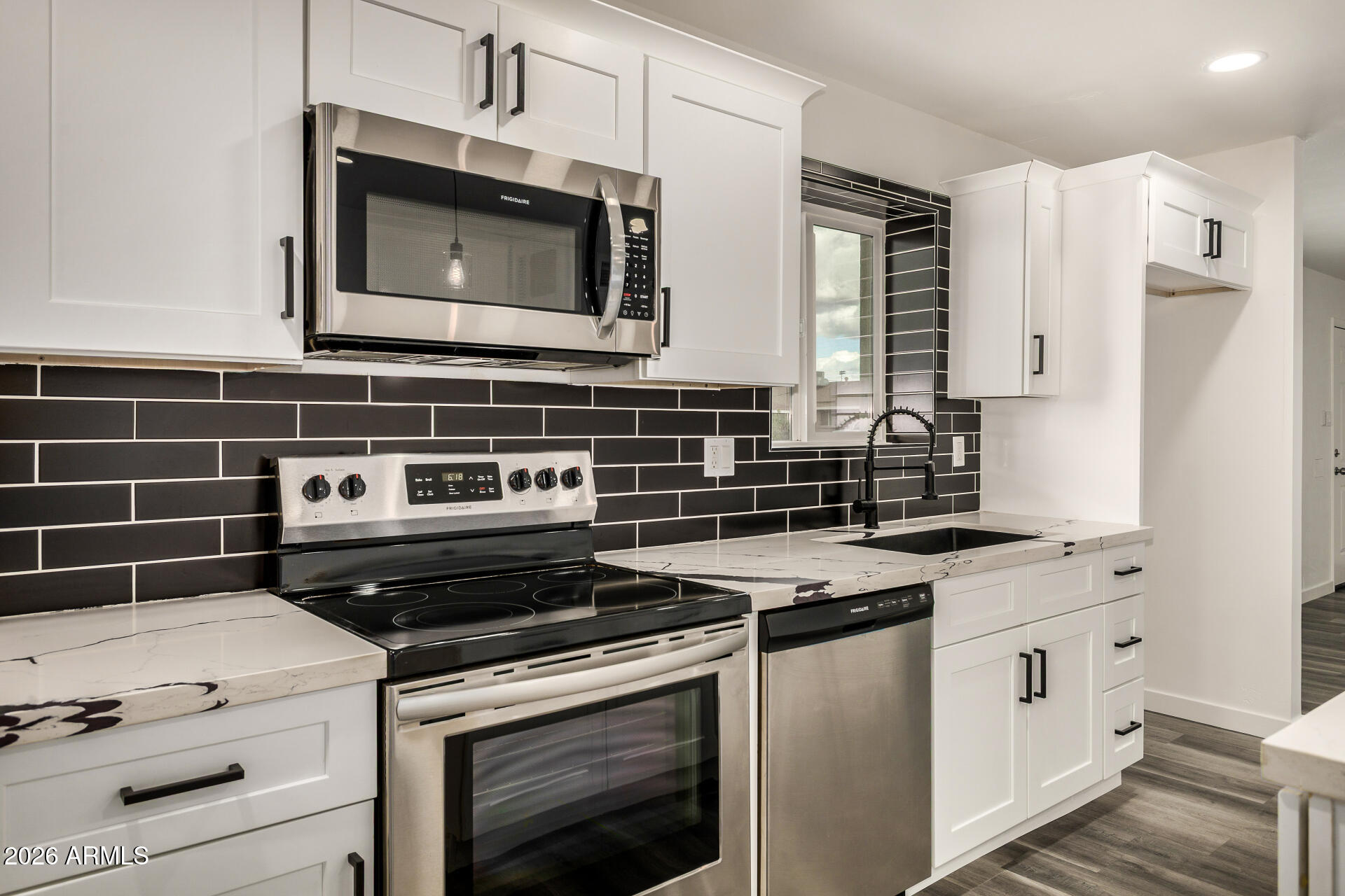 533 West 18th Street Tempe, AZ 85281 - Photo 21 of 52 a kitchen with appliances a sink and cabinets