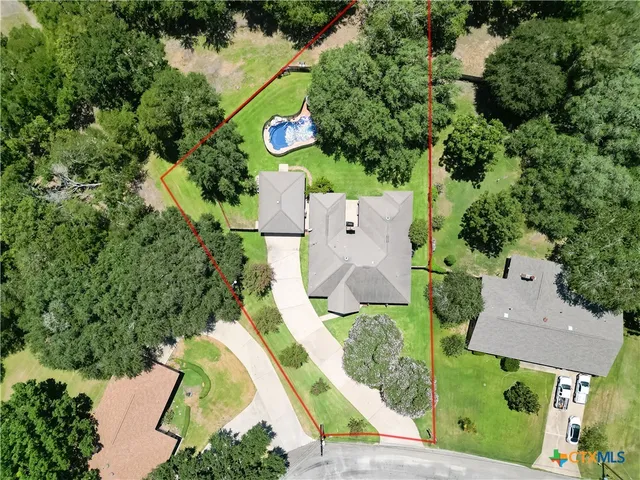 an aerial view of a house with a garden