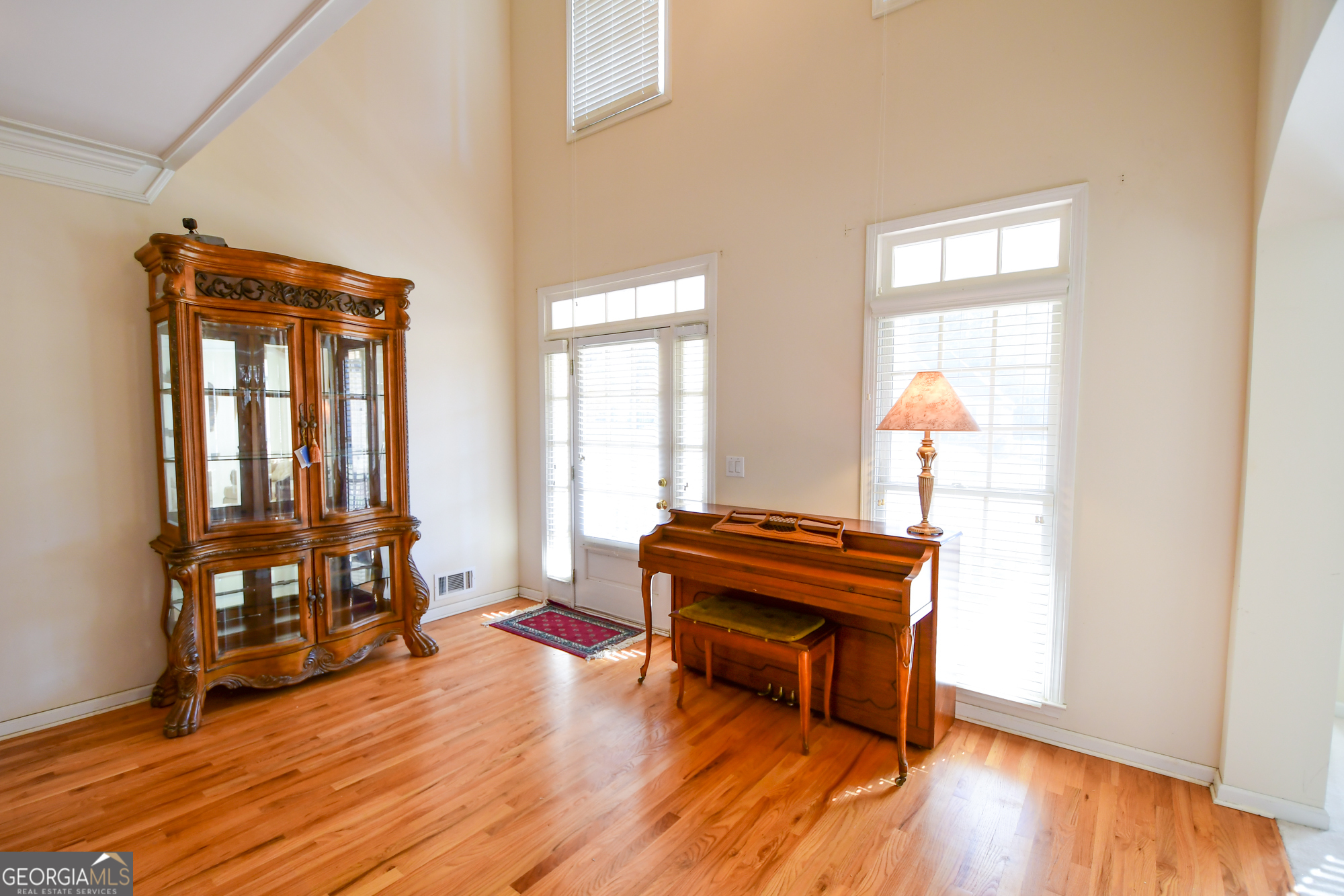 140 Devonshire Place Tyrone, GA 30290 - Photo 10 of 41 a living room with furniture and a wooden floor