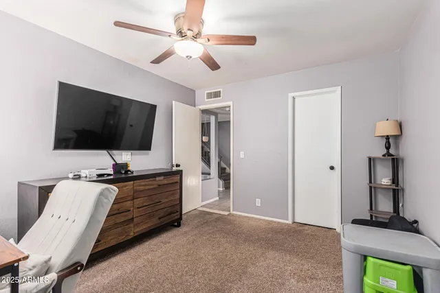 a bathroom with a sink mirror and toilet