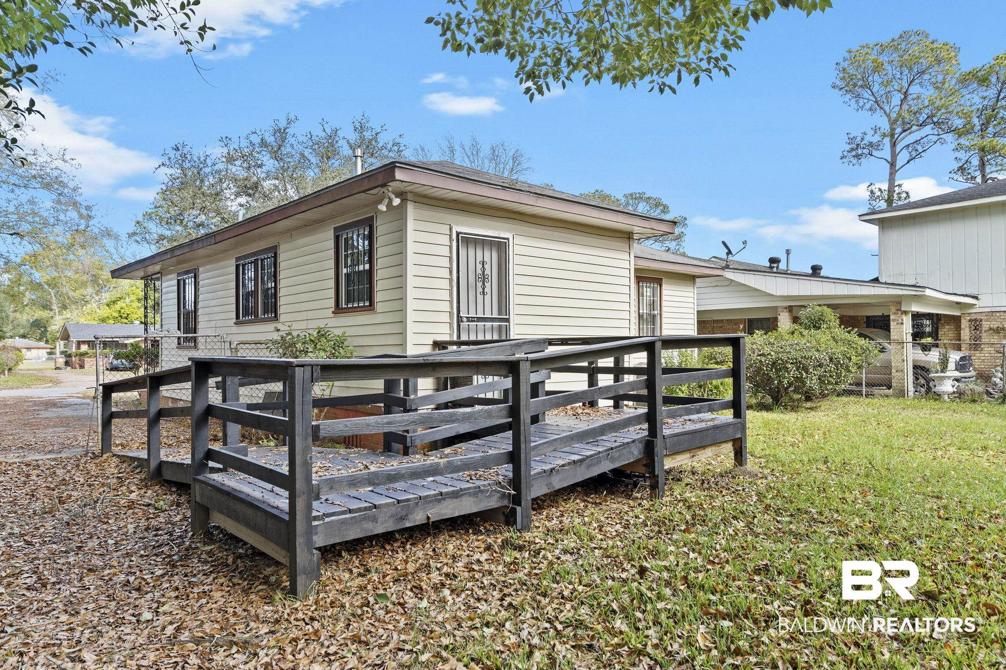 1665 Johnston Street Mobile, AL 36605 - Photo 15 of 17 View of property exterior featuring a deck