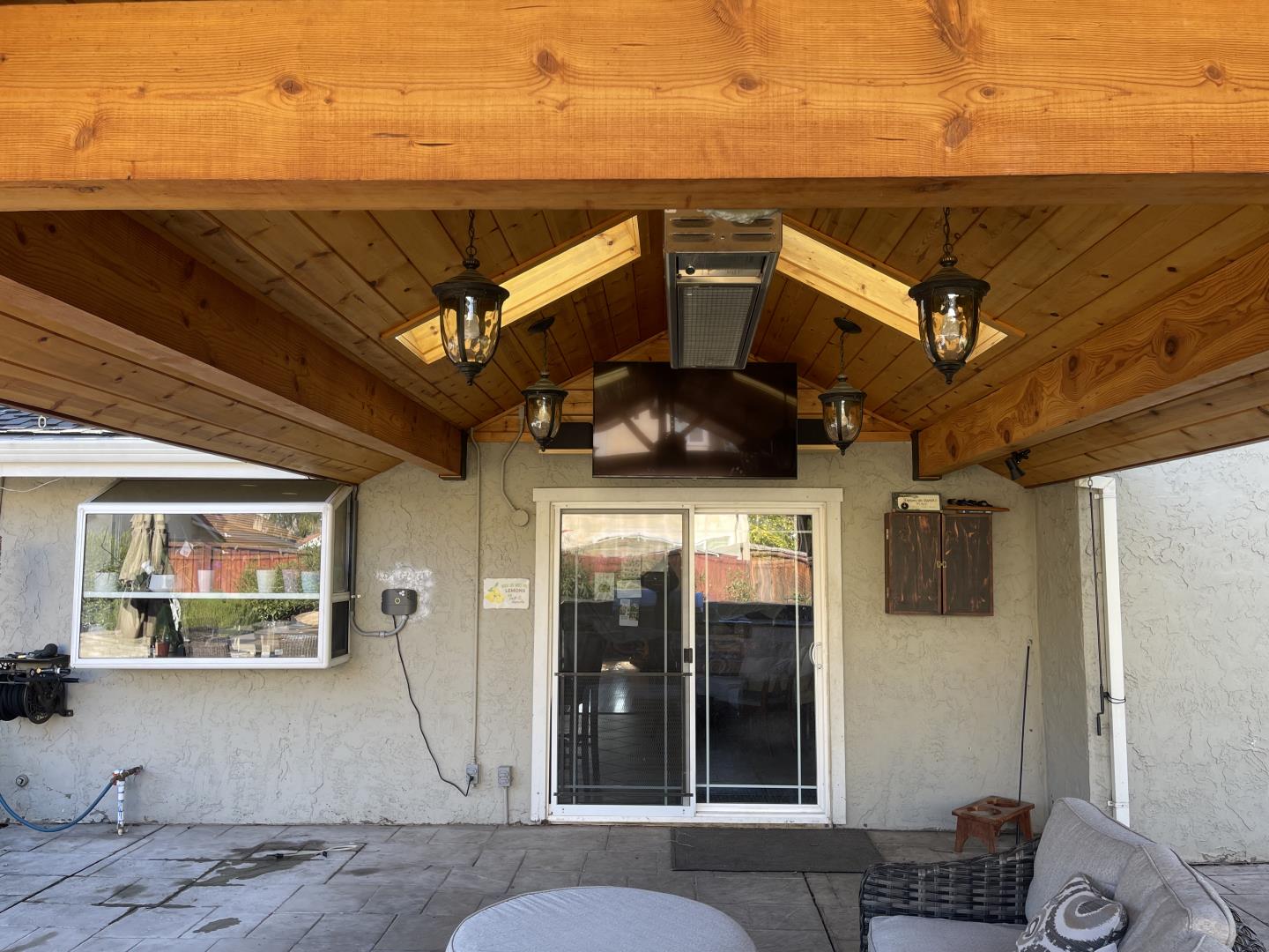 3411 Ruby Court San Jose, CA 95148 - Photo 8 of 12 a view of a building with a flat tv screen and a wooden floor