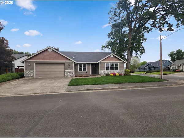 a front view of house with yard and green space