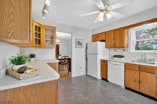 a kitchen with a refrigerator and a sink
