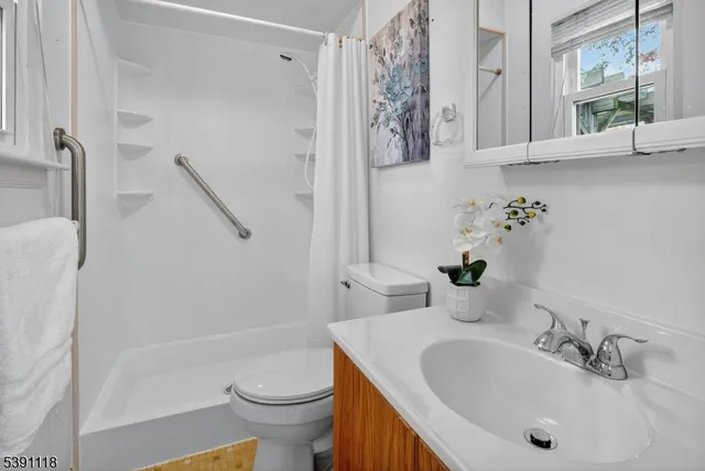 a bathroom with a sink a toilet and a bathtub