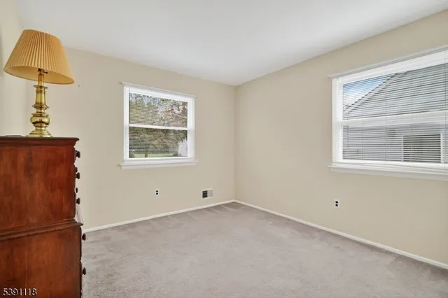 a view of empty room with windows