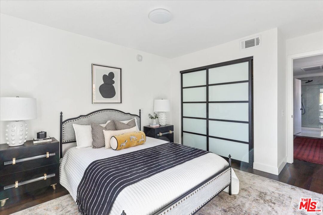 10960 Bluffside Drive, Unit 201 Studio City, CA 91604 - Photo 14 of 23 a bedroom with a bed and a window