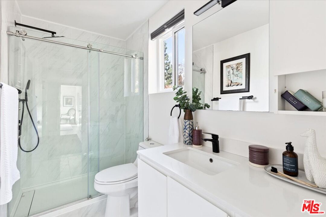 10960 Bluffside Drive, Unit 201 Studio City, CA 91604 - Photo 16 of 23 a bathroom with a sink toilet and shower