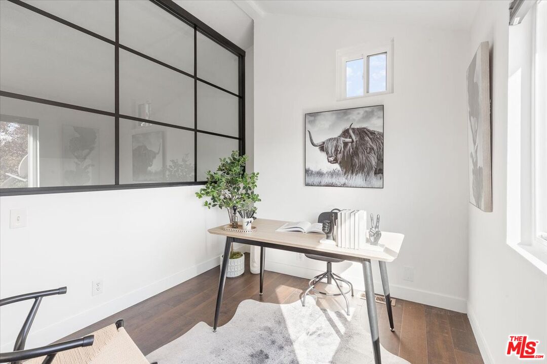 10960 Bluffside Drive, Unit 201 Studio City, CA 91604 - Photo 18 of 23 a view of a workspace with furniture and wooden floor
