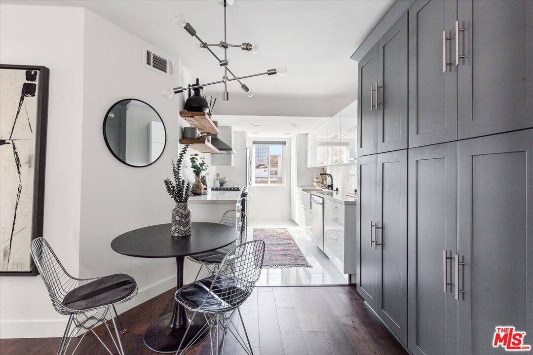 10960 Bluffside Drive, Unit 201 Studio City, CA 91604 - Photo 6 of 23 a dining room with wooden floor a chandelier