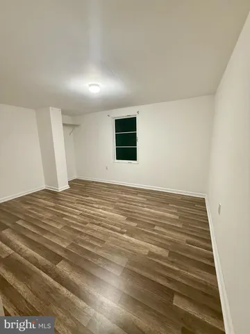 a view of a hallway with the wooden floor