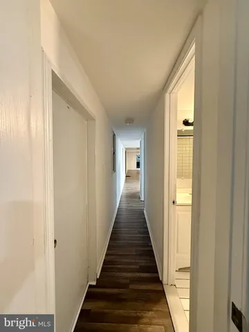 an empty room with wooden floor