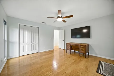 a view of a house with swimming pool and porch
