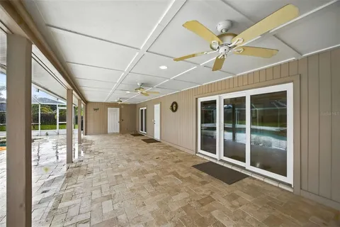 a view of a kitchen with stainless steel appliances granite countertop a stove a sink dishwasher and cabinets