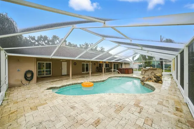 a view of a house with table and chairs