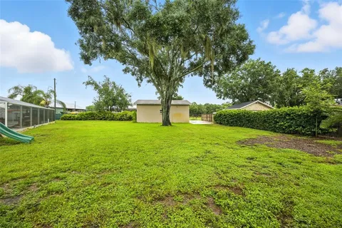 a front view of a house with a yard table and chairs