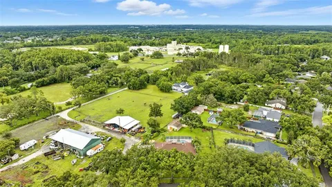an aerial view of residential house with an outdoor space
