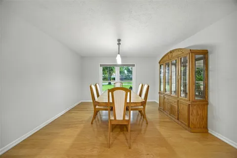 a dining room with furniture and window