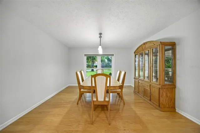a dining room with furniture and window