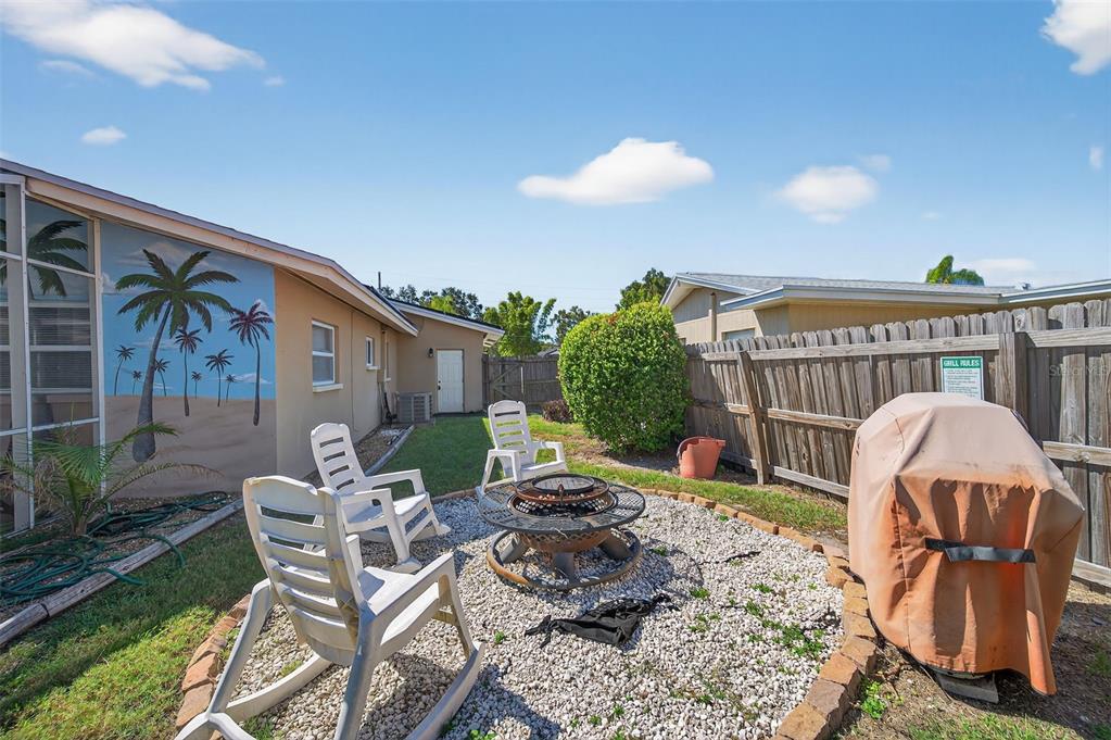 1576 Rosery Road Northeast Largo, FL 33756 - Photo 12 of 54 a view of a patio with a table and chairs
