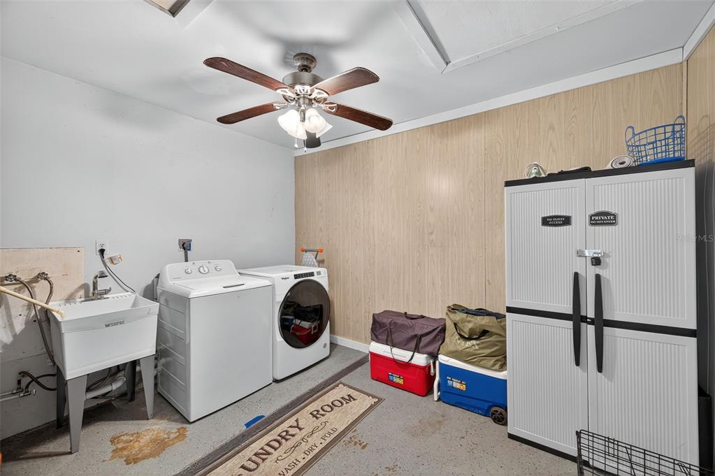 1576 Rosery Road Northeast Largo, FL 33756 - Photo 25 of 54 a utility room with dryer and washer