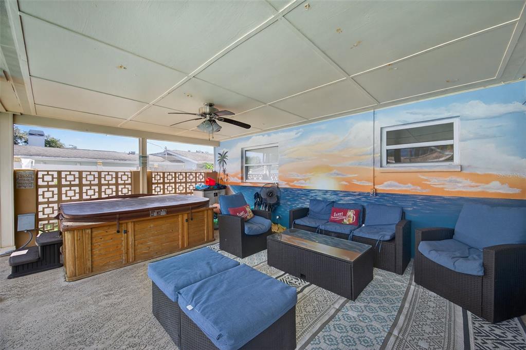1576 Rosery Road Northeast Largo, FL 33756 - Photo 43 of 54 a living room with furniture and a flat screen tv