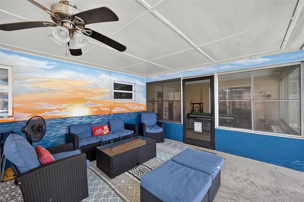 1576 Rosery Road Northeast Largo, FL 33756 - Photo 45 of 54 a living room with furniture and wooden floor