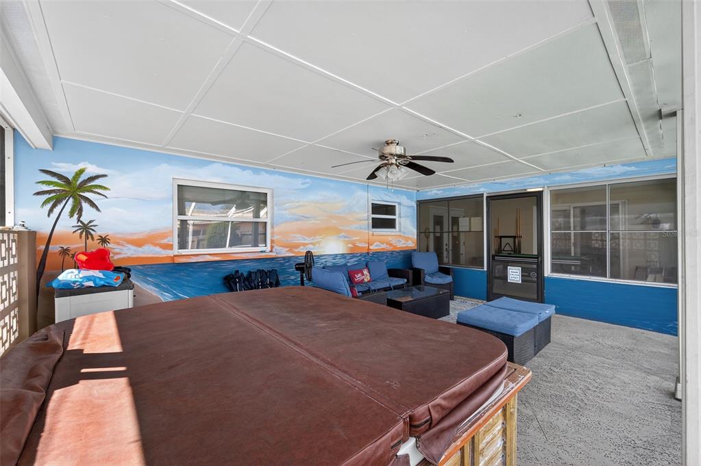 1576 Rosery Road Northeast Largo, FL 33756 - Photo 46 of 54 a bedroom with furniture and a ceiling fan