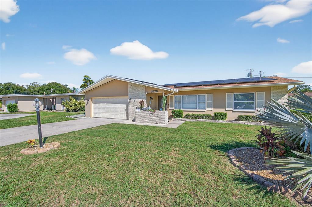 1576 Rosery Road Northeast Largo, FL 33756 - Photo 5 of 54 a house view with a garden space