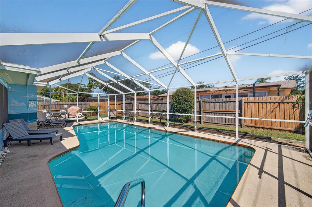 1576 Rosery Road Northeast Largo, FL 33756 - Photo 7 of 54 a view of a patio with a table and chairs